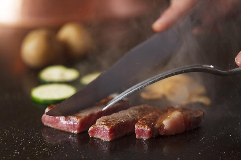 Spacious family suite with multiple beds, play area for children and connecting rooms